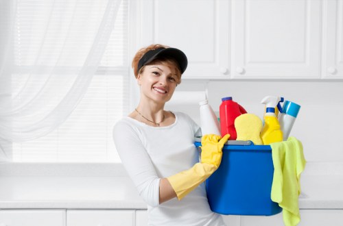 Staff separating textiles, cardboard, and packaging for recycling