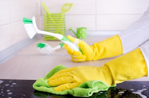Local cleaner treating a corner sofa in Waterloo property